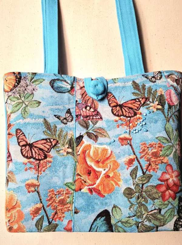 Tekstilmozaikas auduma plecu soma ar oderi un iekškabatu. 9x32x30 cm